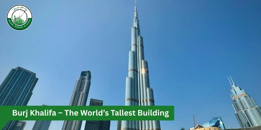 The Burj Khalifa rises prominently at dusk over the Dubai skyline, its sleek, tapering glass tower illuminated against a soft evening sky, with surrounding modern skyscrapers and waterfront buildings in the foreground.